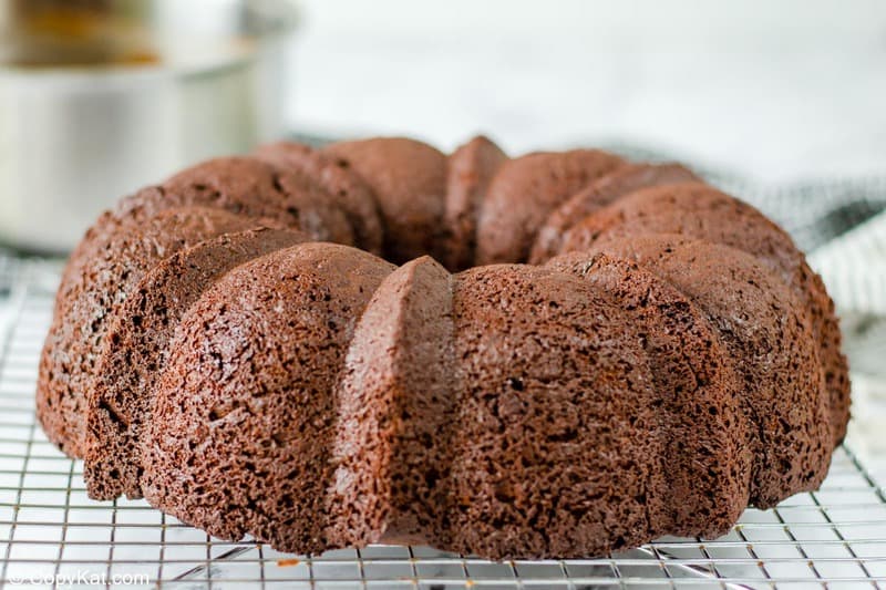 chocolate bundt cake on a wire cooling rack.