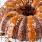 chocolate bundt cake with chocolate glaze on a wire rack.
