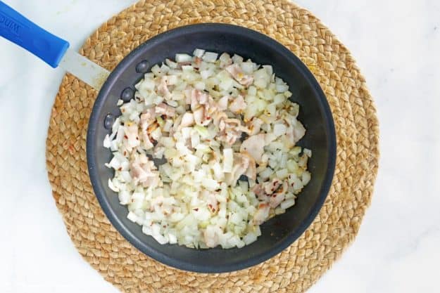 cooked onions, garlic, and prosciutto in a skillet.