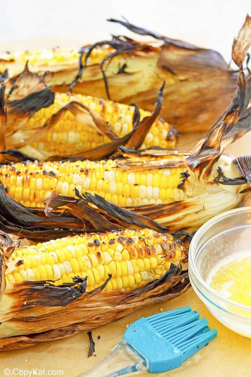 four ears of grilled corn on the cob