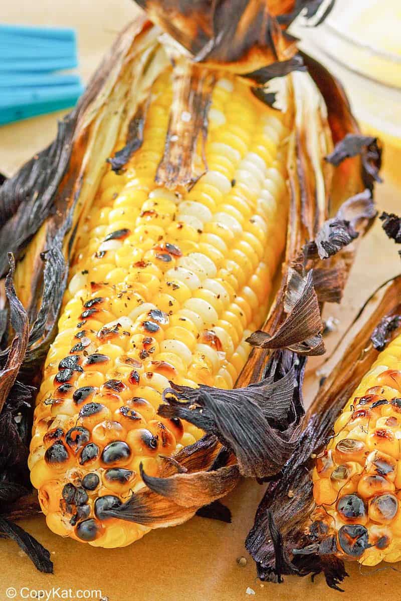 grilled corn on the cob on parchment paper