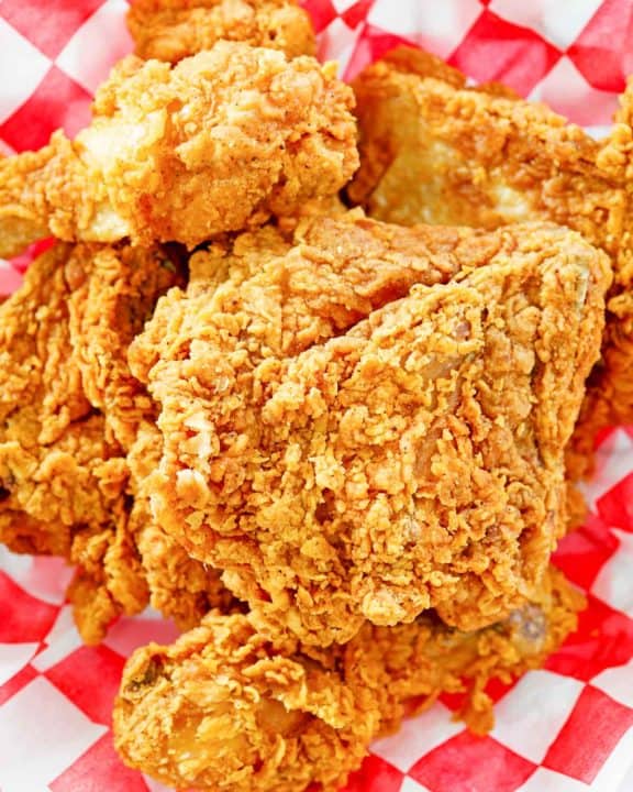 overhead view of homemade KFC fried chicken on parchment paper