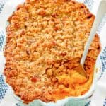sweet potato souffle with pecan topping in a baking dish