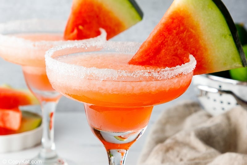 homemade Olive Garden watermelon margarita with a salt rim and watermelon garnish