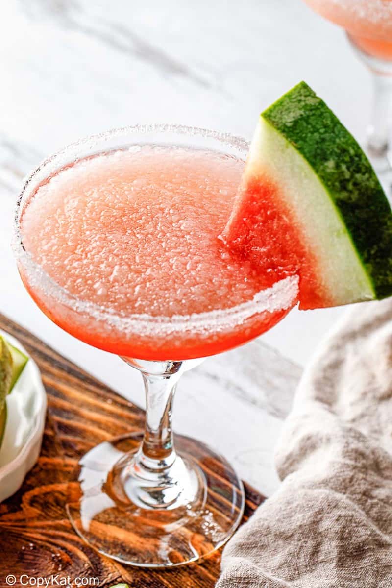 homemade Olive Garden watermelon cocktail garnished with a watermelon slice