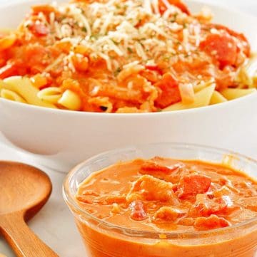 a bowl of vodka sauce in front of a bowl of penne alla vodka.