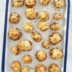 overhead view of sausage stuffed mushrooms on a serving tray.
