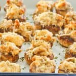 cream cheese and sausage stuffed mushrooms on a serving tray.