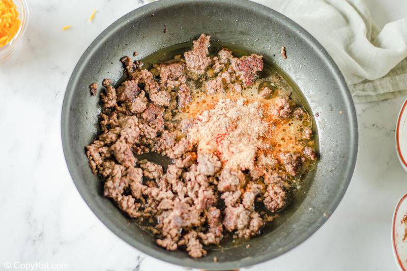 browned ground beef and Mexican seasoning in a skillet