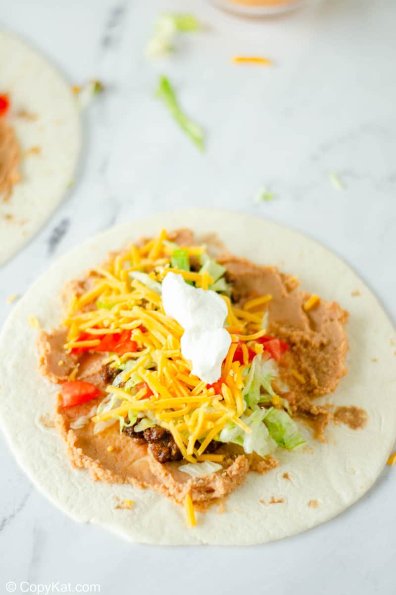 homemade Taco Bell Burrito Supreme fillings on a tortilla