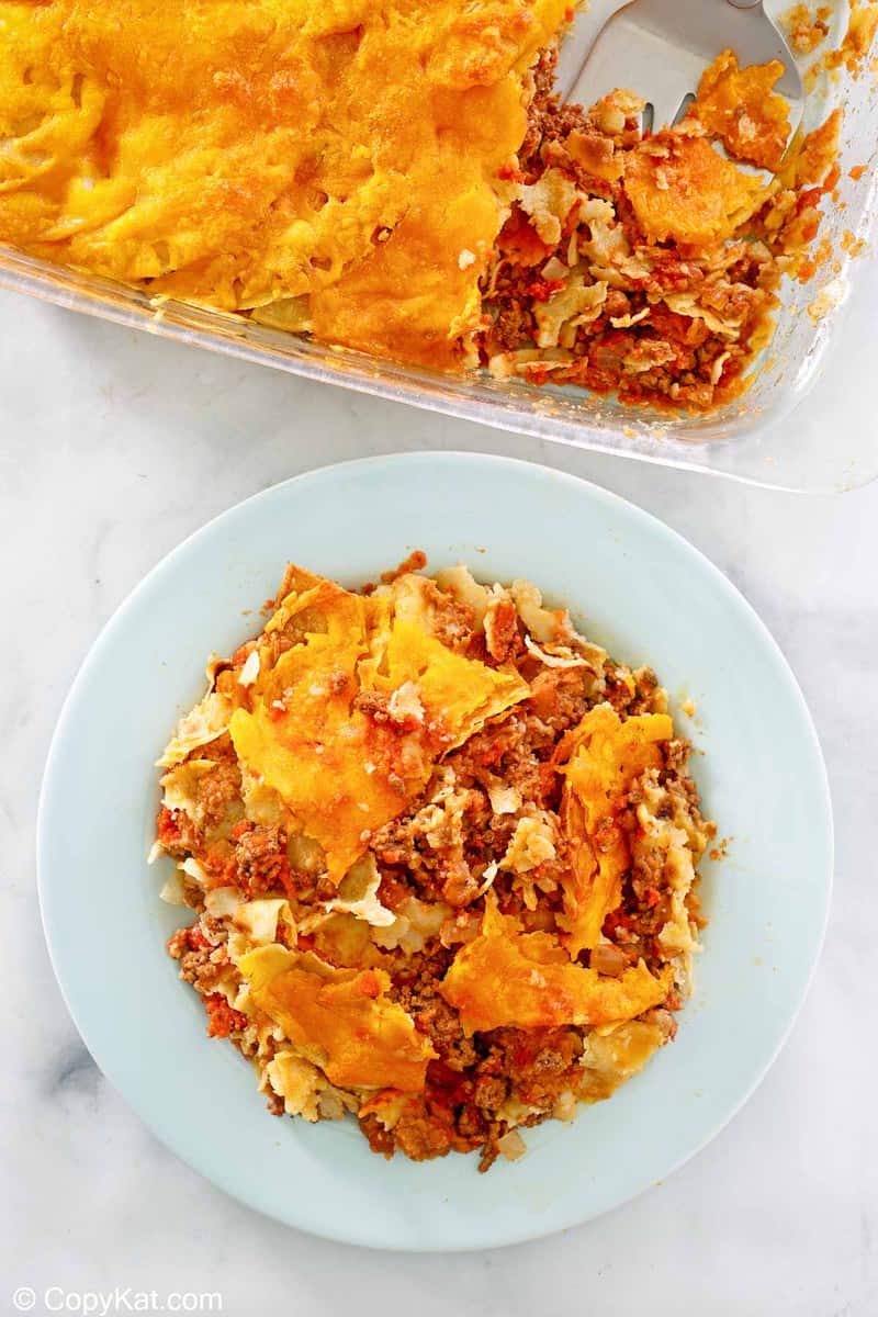 taco casserole in a baking dish and on a plate