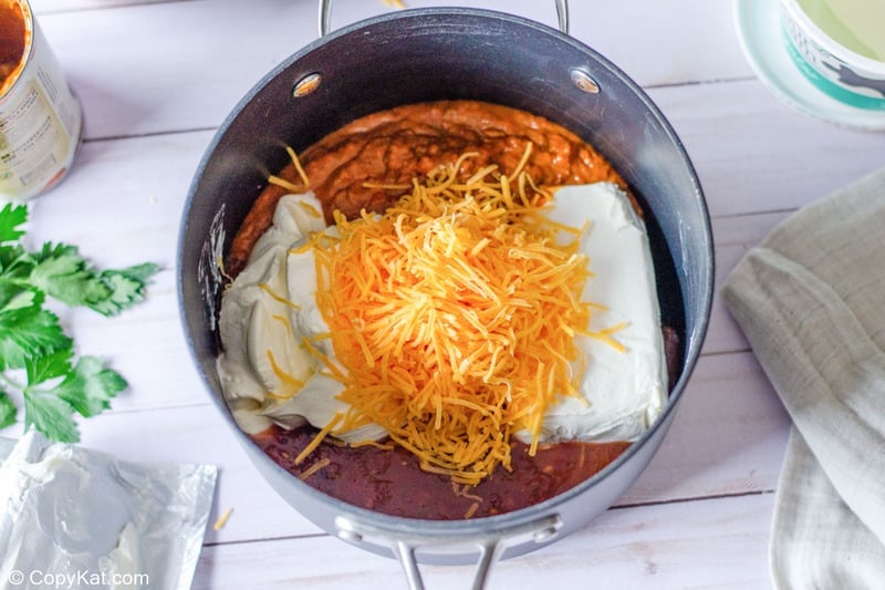 taco dip ingredients in a saucepan.