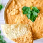 tortilla chip dipped in taco dip