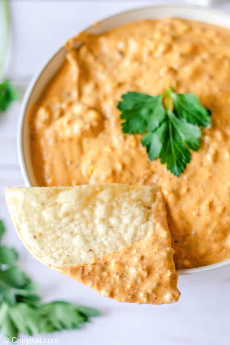 tortilla chip dipped in taco dip