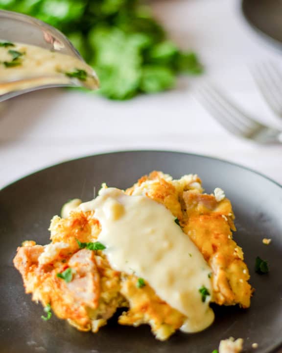 a serving of tarragon chicken casserole with sauce on a plate.