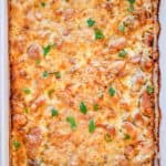 overhead view of tarragon chicken casserole in a baking dish.