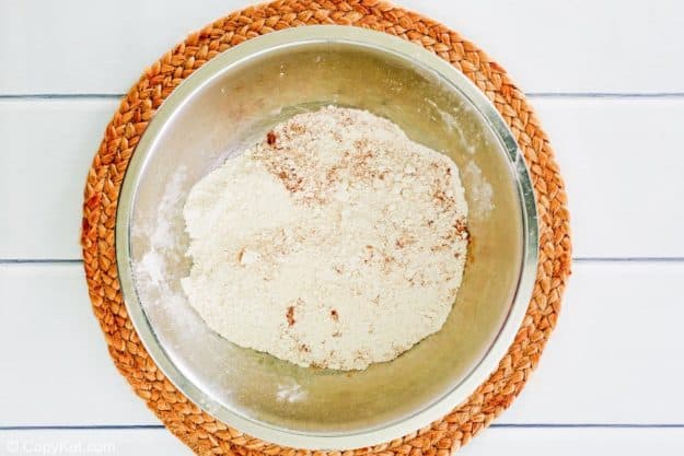 apple muffins dry ingredients in a mixing bowl