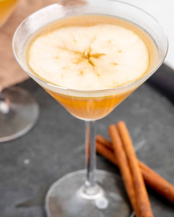 caramel apple martini garnished with an apple slice