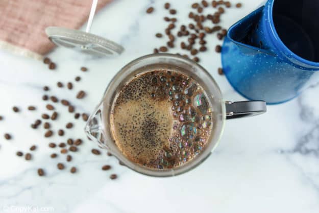 water and coffee grounds in a French press.