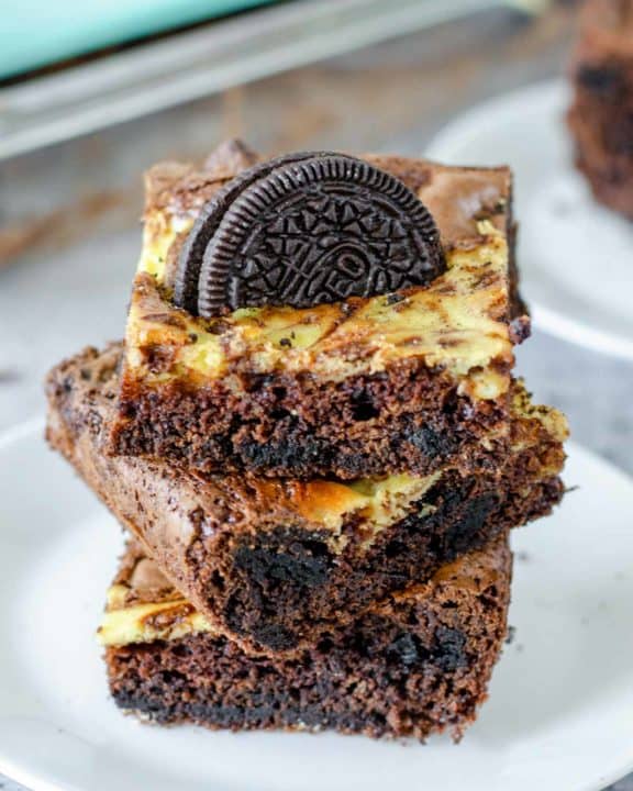 a stack of three Oreo brownies on a plate