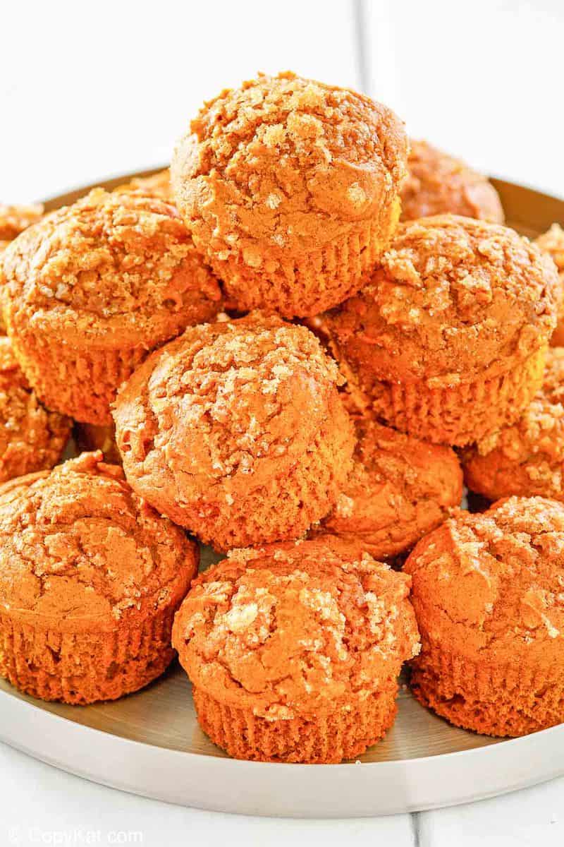a pile of pumpkin muffins on a tray