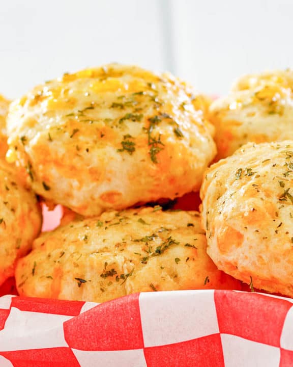 Homemade Red Lobster Cheddar Bay Biscuits on parchment paper.