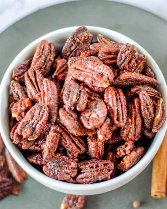overhead view of a bowl of spiced pecans