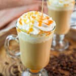 caramel sauce being drizzled on a caramel macchiato.