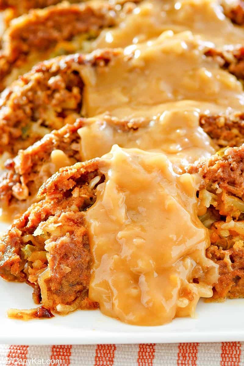 closeup of stuffed meatloaf with gravy on top
