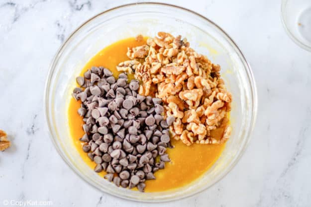 Toll House pie filling base mixture with chocolate chips and nuts on top