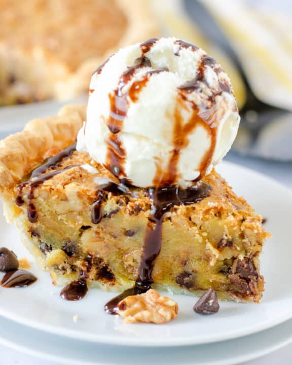 Toll House pie slice topped with ice cream and chocolate syrup