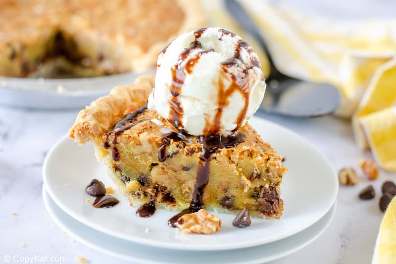 Toll House pie slice topped with ice cream and chocolate syrup