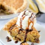 Toll House Pie slice topped with ice cream and chocolate syrup
