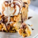 a bite of Toll House pie on a fork in front of a slice
