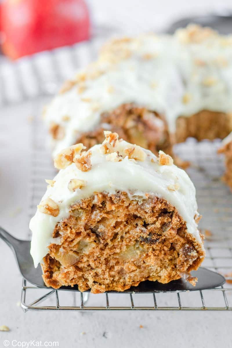 a slice of apple spice cake on a cake server.
