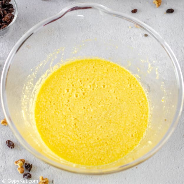 spice cake wet ingredients combined in a mixing bowl.