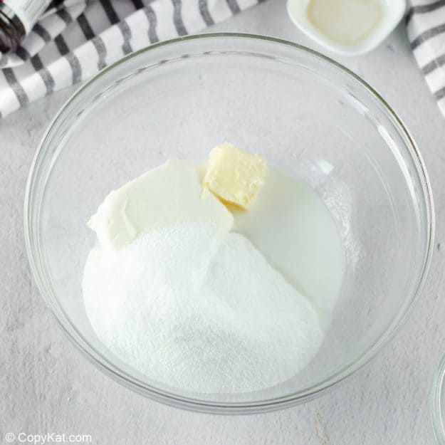 ingredients for cream cheese frosting in a bowl.