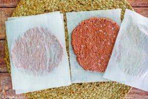 rolled out beyond burger patties between parchment paper.