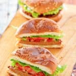 homemade Burger King Impossible Whopper burgers on a wood board.