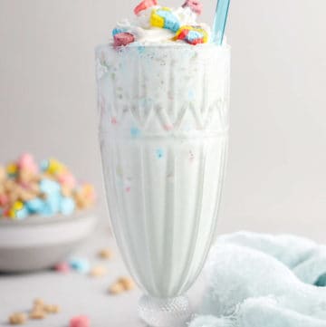 homemade Burger King Lucky Charms milkshake and a blue kitchen towel.