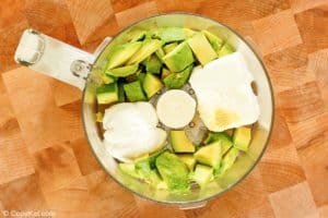 chopped avocado, cream cheese, sour cream, and seasonings in a food processor.