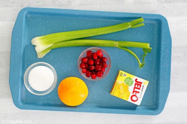 cranberry Jello salad ingredients on a tray.
