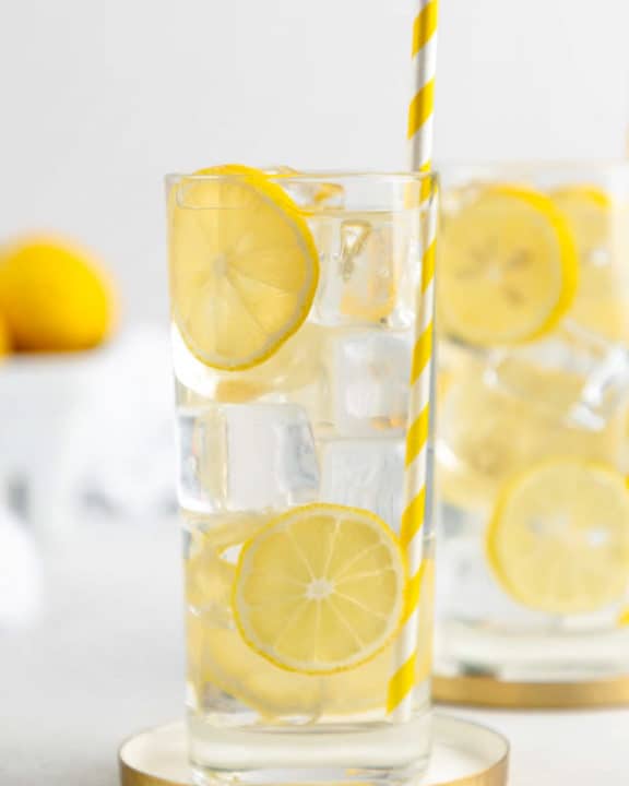 a glass of homemade lemonade garnished with lemon slices.