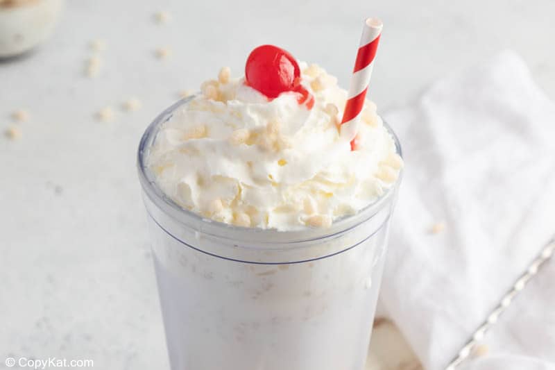 homemade Jack in the Box rice krispie milkshake with whipped cream and a cherry.