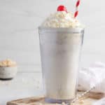 homemade jack in the box rice krispie shake with whipped cream and a cherry.