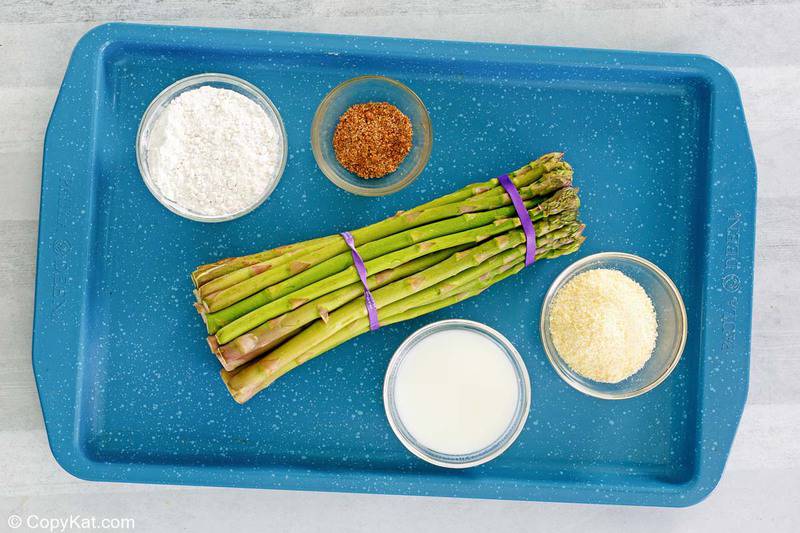 Longhorn Steakhouse parmesan crusted asparagus ingredients on a tray.