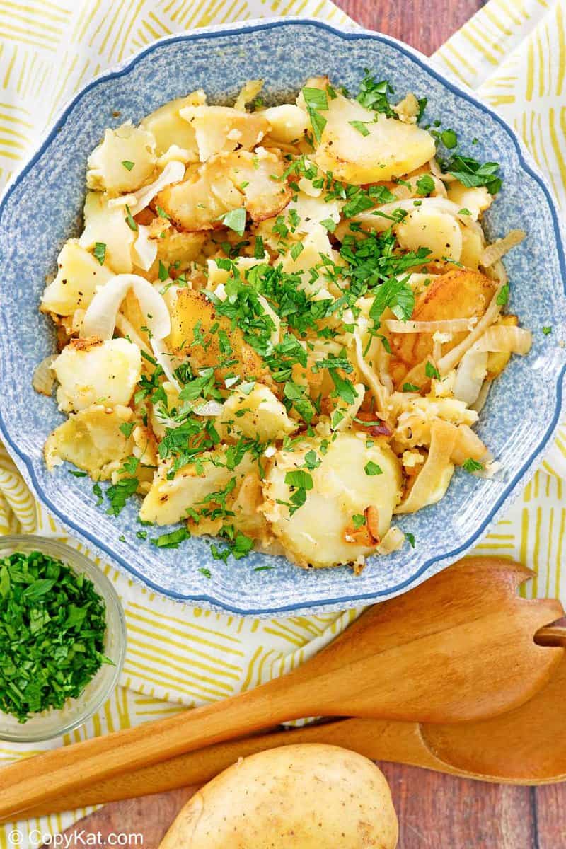 overhead view of lyonnaise potatoes in a bowl.