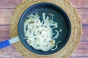 sautéed onion slices in a skillet.