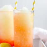 two glasses of homemade McDonald's frozen strawberry lemonade drinks on a tray.