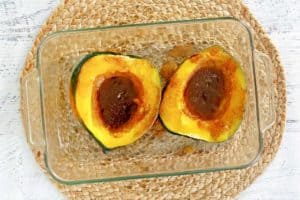 acorn squash with brown sugar butter sauce before being broiled.